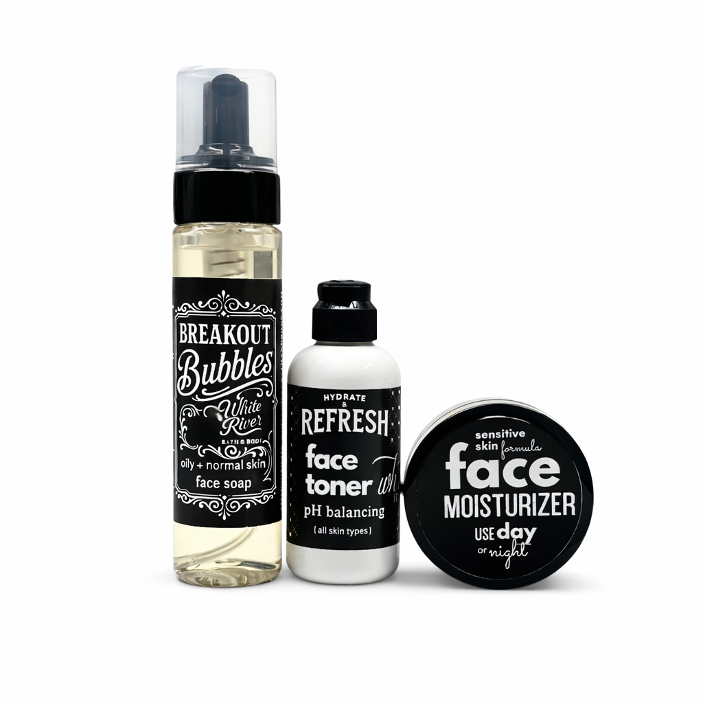 Three skincare products with black and white labels on a white background