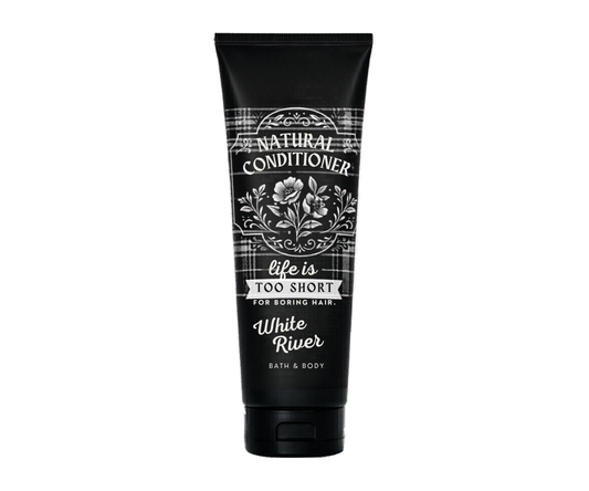 Black tube of 'Natural Conditioner' with floral design and text on a white background