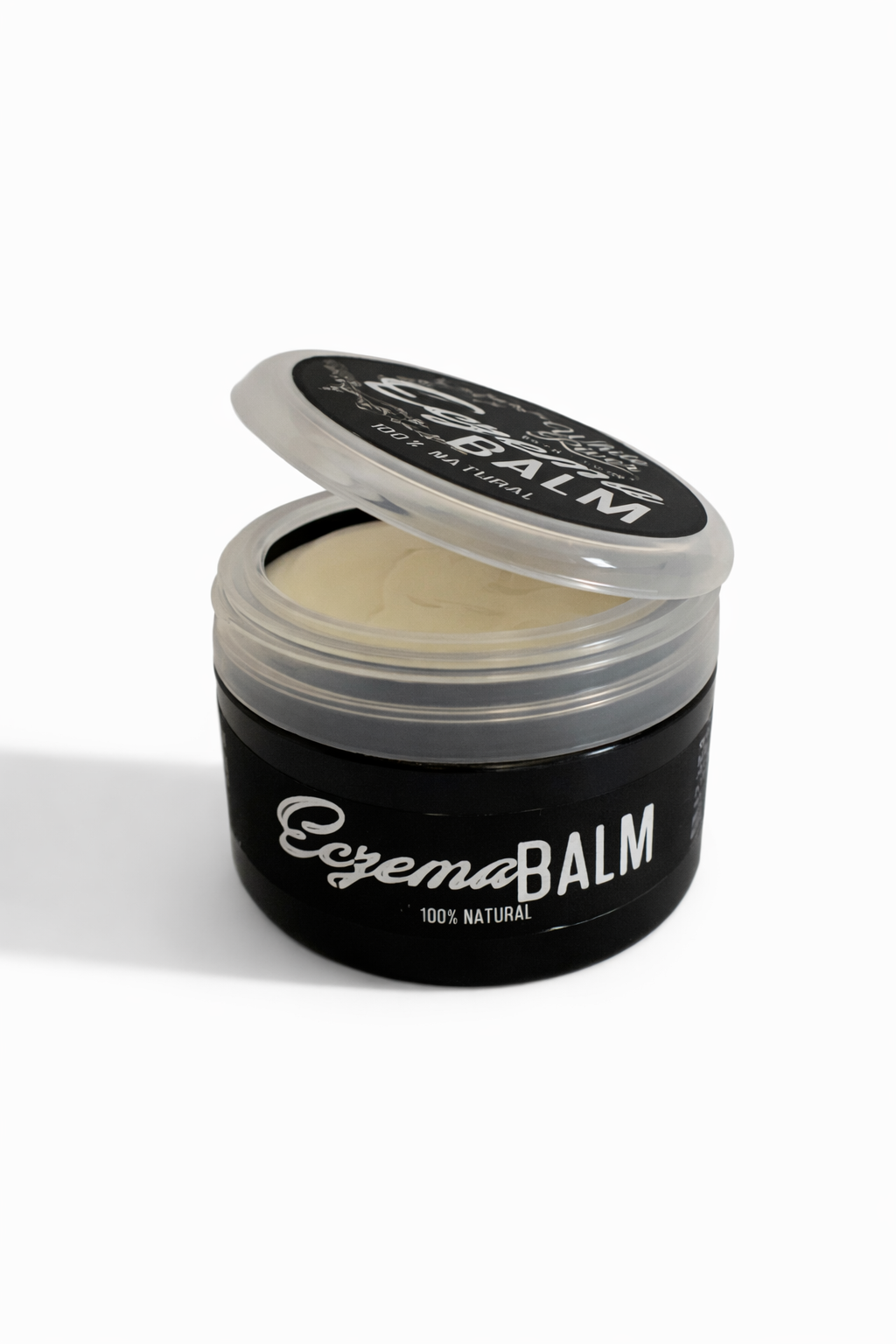 Open jar of Eczema Balm on a white background