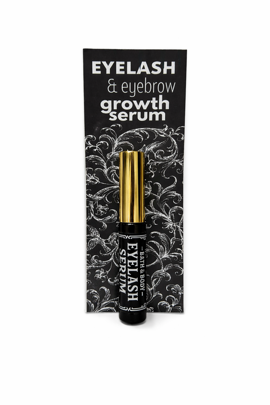 Eyelash and eyebrow growth serum packaging with black and gold design on a white background