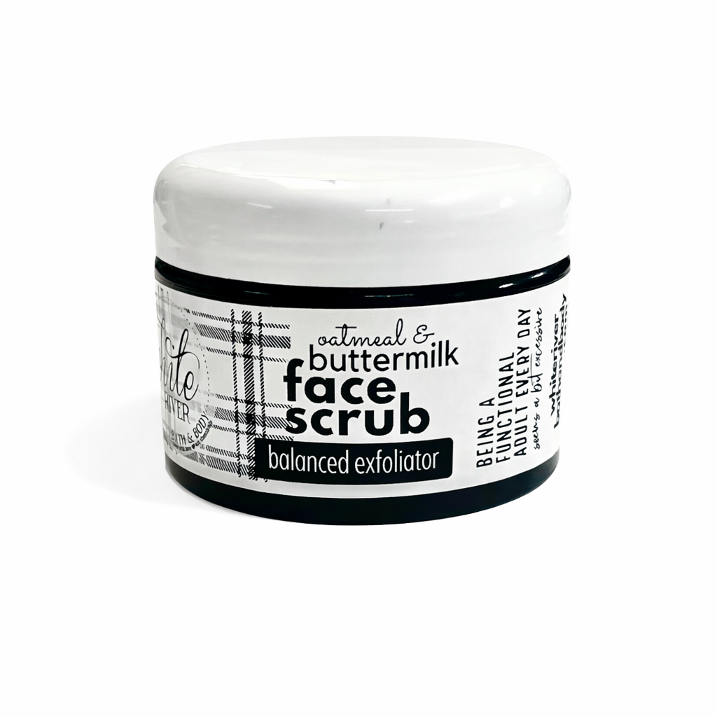Jar of face scrub with a label on a white background