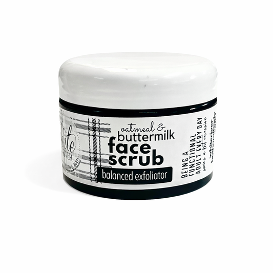 Jar of face scrub with a label on a white background