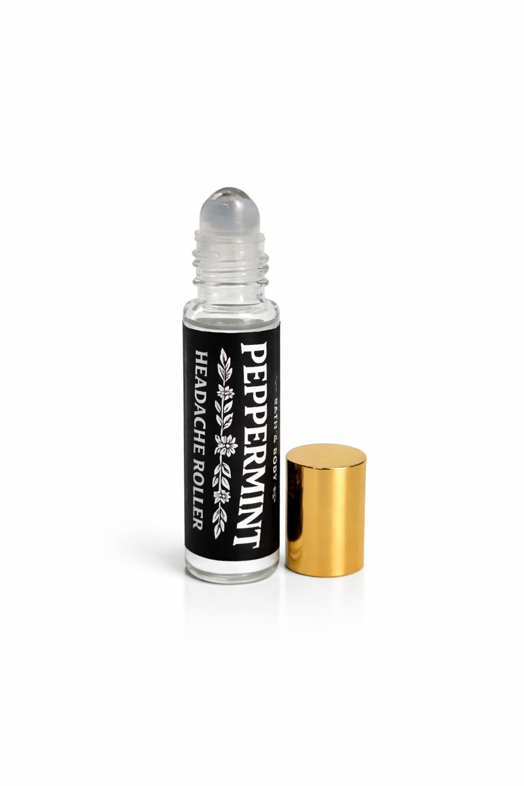 Peppermint headache roller bottle with gold cap on a white background