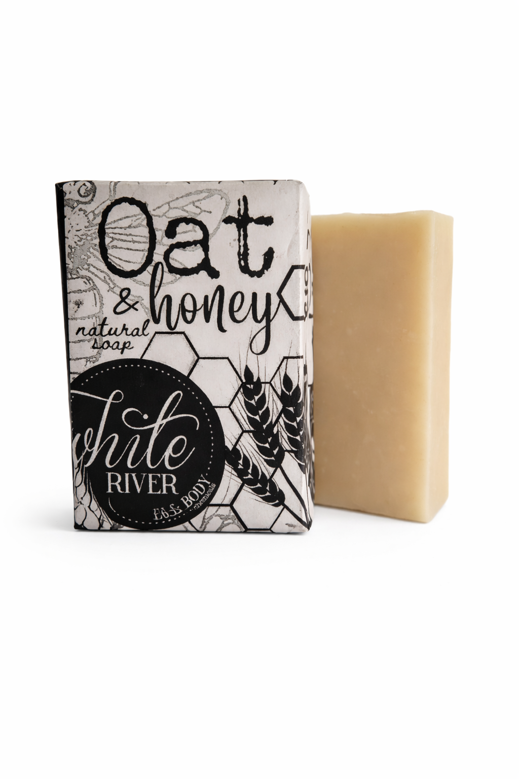 Bar of soap with a packaging labeled 'Oat & Honey' from 'White River Soap Co.'