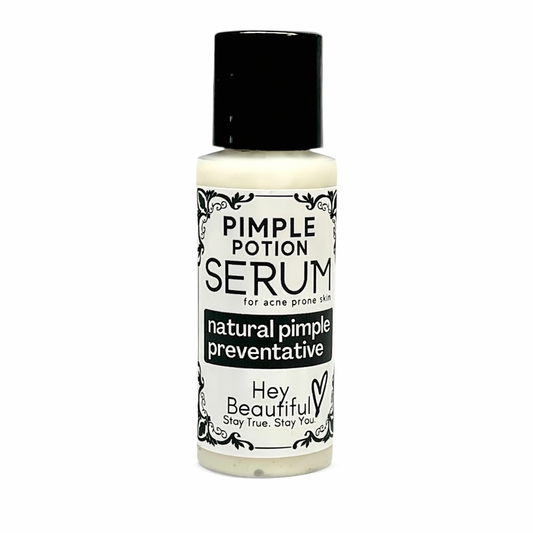 White bottle of VERB Ghost Dry Oil with black cap on a white background