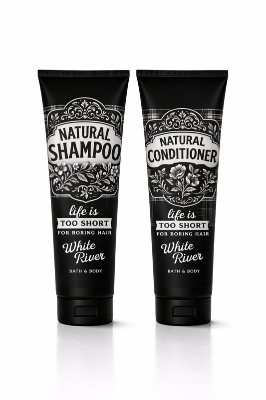 Two Black & White shampoo and conditioner bottles with decorative labels on a white background